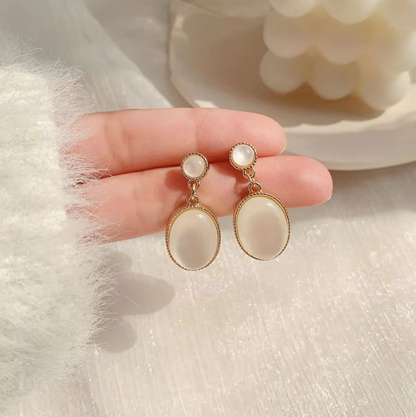 Beautiful Opal Oval Drop Earrings Showcasing a Radiant Glow